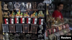 A shopkeeper waits for tourists at a souvenir shop in old Cairo, Oct. 29, 2013.