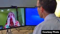 Diana Rae of Tenino, Washington, demonstrates virtual urgent care with Dr. Ben Green in Seattle, who consults with her via Skype. (Courtesy of Franciscan Health System)