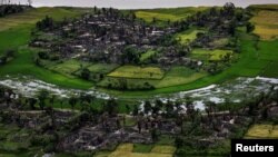 FILE - The remains of a burned Rohingya village is seen in this aerial photograph near Maungdaw, north of Rakhine State, Myanmar Sept. 27, 2017. 