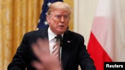 U.S. President Donald Trump takes questions during a joint news conference with Poland's President Andrzej Duda in the East Room of the White House in Washington, Sept. 18, 2018. 