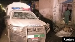 A damaged police vehicle is see after a remote-controlled bomb blast in Pakistan-Afghanistan border town of Chaman, Pakistan, March 23, 2021. 