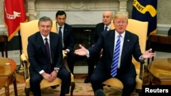 FILE - U.S. President Donald Trump meets with Uzbekistan President Shavkat Mirziyoyev at the White House in Washington, May 16, 2018. 