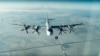 FILE - A Tu-95 strategic Russian bomber is in flight over Syria, from footage taken from the Russian Defense Ministry official website, Nov. 17, 2016. 