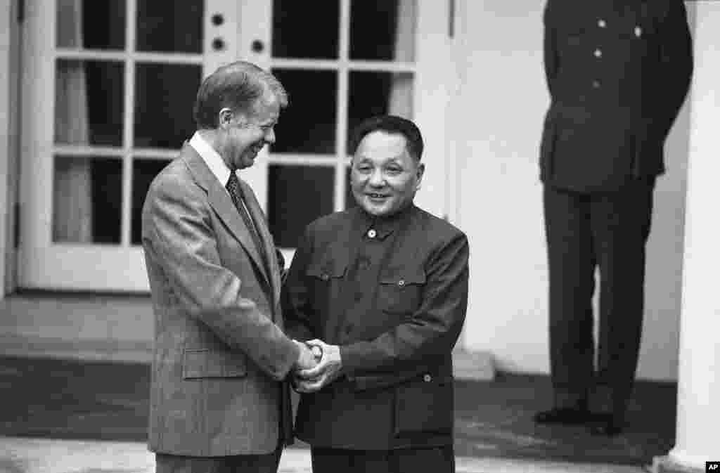 President Jimmy Carter and Chinese Vice Premier Teng Hsiao-ping hold hands outside the Oval Office of the White House, Jan. 30, 1979.