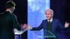 Right-wing populist leader Geert Wilders gestures as he talks to Dutch Prime Minister Mark Rutte, left, during a national televised debate, the first head-to-head meeting of the two political party leaders since the start of the election campaign, at Erasmus University in Rotterdam, Netherlands, March 13, 2017.
