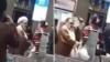 These images from video show a confrontation between a woman and a cleric over compulsory hijab laws, at Mehrabad Airport in Tehran, Iran, on Monday.
