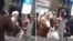 These images from video show a confrontation between a woman and a cleric over compulsory hijab laws, at Mehrabad Airport in Tehran, Iran, on Monday.
