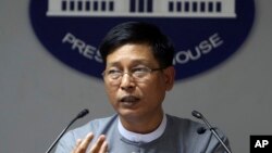 FILE - Myanmar government spokesman Zaw Htay talks to journalists during a news briefing at the Presidential Palace in Naypyitaw, Myanmar, Sept 13, 2017.
