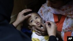 Child receives a polio vaccine in Islamabad, Pakistan, Oct. 16, 2012.