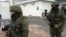Unidentified gunmen on patrol at Simferopol Airport in Ukraine's Crimea peninsula, Feb. 28, 2014 (Elizabeth Arrott/VOA) 