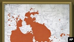 A poster of Angelina Jolie's 'In the Land of Blood and Honey' film in Belgrade, Feb. 24, 2012.