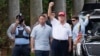 FILE - U.S. President Donald Trump gestures to supporters as he leaves the Trump International Golf Club on Feb. 17, 2025, in West Palm Beach, Florida. As Trump prepares for his annual physical exam, his main source of exercise is golf.