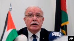 Palestinian Foreign Minister Riad Malki speaks during a press conference at the International Criminal Court, May 22, 2018.