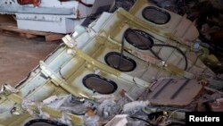 Part of the fuselage of crashed AirAsia Flight QZ8501 is seen inside a storage facility at Kumai port in Pangkalan Bun, Jan. 19, 2015. 