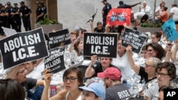 Hundreds of activists protest the Trump administration's approach to illegal border crossings and separation of children from immigrant parents, in the Hart Senate Office Building on Capitol Hill in Washington, June 28, 2018. 