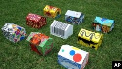 Miniature version of tents international artists are painting for Haitian children