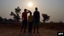 FILE - photo taken on February 11, 2016 shows three children living in the camp for Internally displaced people (IDP) of Mpoko, and claiming to be victims or witnesses of sex abuses on minors by peacekeeper soldiers of the French Sangaris operation, posing in Bangui.