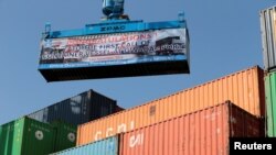 FILE - A container ship prepare to leave the China Pakistan Economic Corridor port in Gwadar, Pakistan, Nov. 13, 2016. Chinese investments in commercial ports around the world could pave the way for China to expand its military footprint, said an analyst in January 2023.