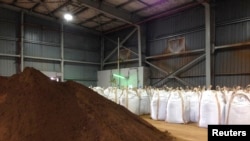 FILE - Rare earths dug up and processed into concentrate at Mount Weld in western Australia are pictured after being shipped to a plant in Gebeng, Malaysia, July 3, 2014.