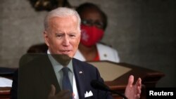 U.S. President Joe Biden addresses a joint session of Congress at the U.S. Capitol in Washington, April 28, 2021. 