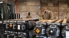 Airmen and civilians load ammunition, weapons and other equipment bound for Ukraine at Dover Air Force Base, Delaware, Jan. 21, 2022.