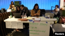Volunteer immigration attorneys organize to help as people gather to protest against President Donald Trump's executive order travel ban at Los Angeles International Airport, Jan. 31, 2017.