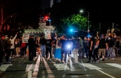 Demonstrators block traffic during a protest, May 27, 2020, in Los Angeles over the death of George Floyd in Minneapolis police custody earlier in the week.