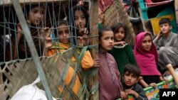 Afghan refugees arrive on trucks from Pakistan at the Afghanistan-Pakistan Torkham border in Nangarhar province on Nov. 1, 2023.