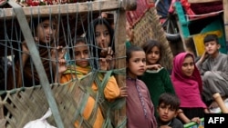 Afghan children refugees arrive on trucks from Pakistan at the Afghanistan-Pakistan Torkham border in Nangarhar province on Nov. 1, 2023.