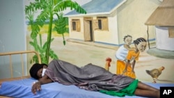 A newly-diagnosed HIV positive woman in the treatment ward of the Mildmay, Uganda clinic, Feb. 27, 2014. 
