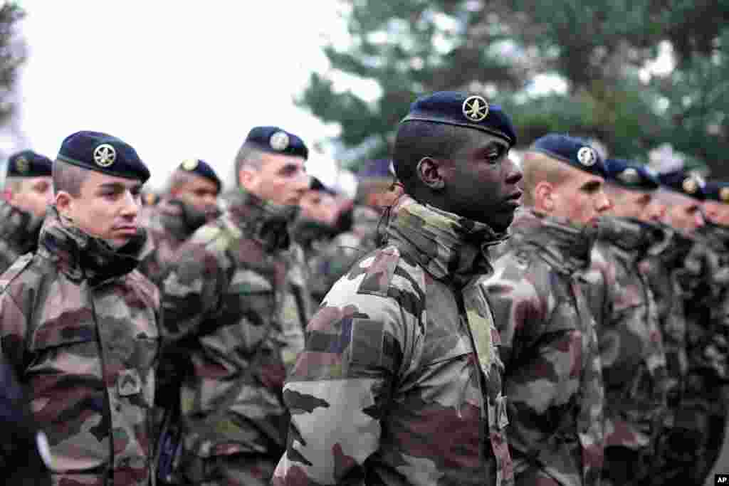 French soldiers line up to listen to a speech by the French Defense Minister Jean Yves Le Drian, at the Satory military camp in Versailles, west of Paris, Jan. 15, 2015.