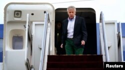 U.S. Defense Secretary Chuck Hagel walks off an aircraft upon his arrival at Yokota Air Force Base in Fussa, Japan, April 5, 2014.