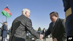 Defense Secretary Robert Gates greets Afghanistan Defense Minister of National Defense Abdul Rahim Wardak at the Pentagon, February 23, 2011
