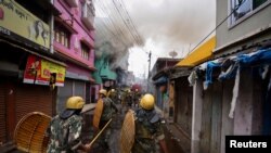 Security personnel patrols on a street after violence erupted between police and protestors over a comment on Prophet Mohammed by Bharatiya Janata Party (BJP) member Nupur Sharma, in Howrah on the outskirts of Kolkata, India, June 11, 2022. 