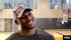 NBA player Bismack Biyombo supports education and public health efforts in the Democratic Republic of Congo, his home country. He’s shown at the Phoenix Suns’ practice facility. (Betty Ayoub/VOA) 