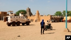 FILE - United Nation forces patrol the streets of Timbuktu, Mali, Sept. 26, 2021. A two-week blockade by Islamist militants has created food and aid shortages in the ancient city of Timbuktu, the mayor and residents said on Aug. 28, 2023.  