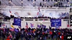 FILE - Supporters of then-President Donald Trump storm the Capitol, in Washington, Jan. 6, 2021.