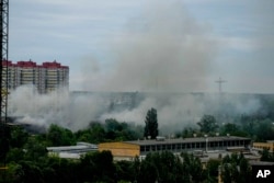 Smoke rises after a Russian missile strike in Kyiv, Ukraine, Sunday, June 5, 2022.