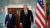 FILE - Former U.S. Secretary of State Mike Pompeo, right, arrives with Maldives Foreign Minister Abdulla Shahid, Feb. 20, 2019, at the Department of State in Washington. 
