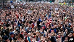 FILE - Looking west, people fill Pennsylvania Avenue during the "March for Our Lives" rally in support of gun control, March 24, 2018, in Washington.