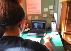 A student at Norristown Area High School takes part in virtual Spanish class at her home in Norristown, Pa., Sept. 3, 2020.