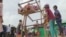 Children enjoy a manual Ferris wheel ride during the Eid Al-Adha religious celebration at the Kutipalong refugee camp in Cox's Bazar this week.