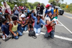 Migrants beg and pray not to be taken away by Mexican immigration authorities during a raid on a migrant caravan that had earlier crossed the Mexico - Guatemala border, near Metapa, Chiapas state, Mexico, June 5, 2019.