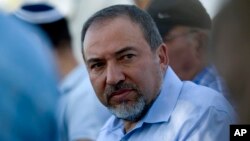 FILE - Israel's Foreign Minister Avigdor Lieberman meets with local residents in Mitzpe Gadot, Northern Israel, overlooking the Golan Heights, Nov. 11, 2010.