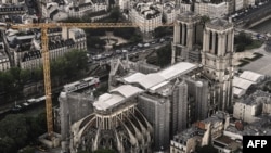 FILE - An aerial picture taken on July 12, 2021 shows a view of the Notre-Dame de Paris Cathedral on the "Ile de la Cite" island in the Seine river in Paris.