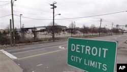 A street sign showing Detroit's city limits is shown near where a former Chrysler McGraw glass plant is being torn down along Ford Road in Detroit, March 22, 2011