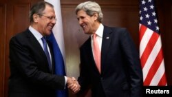 U.S. Secretary of State John Kerry (R) shakes hands with Russian Foreign Minister Sergey Lavrov at the start of their meeting in Berlin, February 26, 2013. 