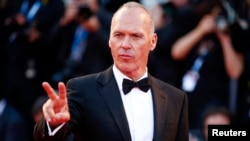 FILE - Actor Michael Keaton, who received a Golden Globe nomination for Best Actor in a Comedy or Musical for his role in "Birdman," appears at the 71st Venice Film Festival, Aug. 27, 2014. 
