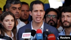 Venezuelan opposition leader Juan Guaido, whom a number of nations have recognized as the country's rightful interim president, talks to the media after attending a religious service in Caracas, Venezuela, Feb. 10, 2019. 