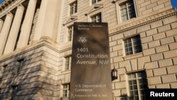 FILE - The Department of Commerce building is seen before an expected report of new home sales numbers in Washington, Jan. 26, 2022.